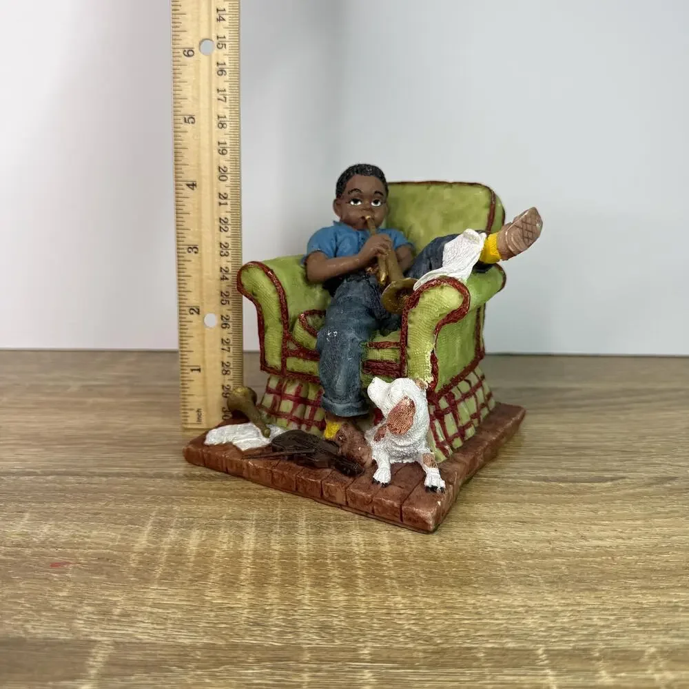 Vintage Boy Figurine Sitting On Chair with Saxophone and Dog Figure